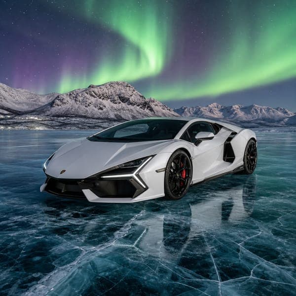 Lamborghini Revuelto jigsaw puzzle — A white Lamborghini Revuelto on arctic ice beneath green aurora.