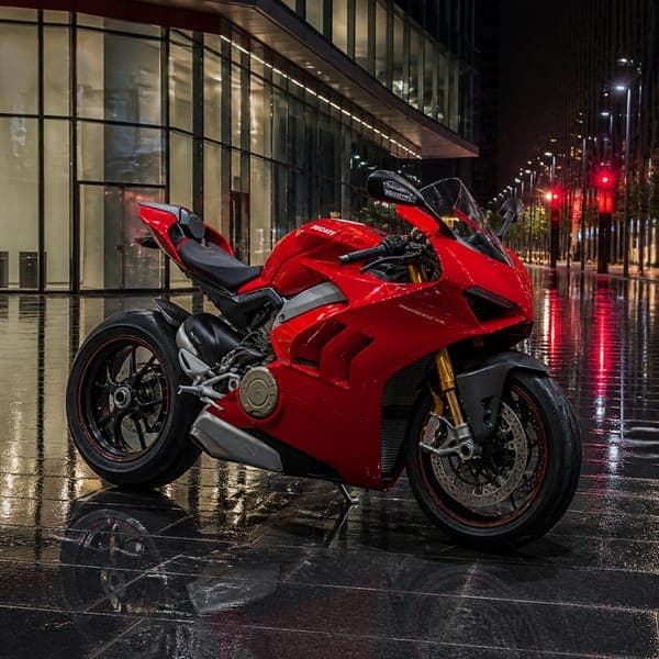 Red Superbike in the Rain jigsaw puzzle — A red superbike on wet city stone, tail lights streaking behind.