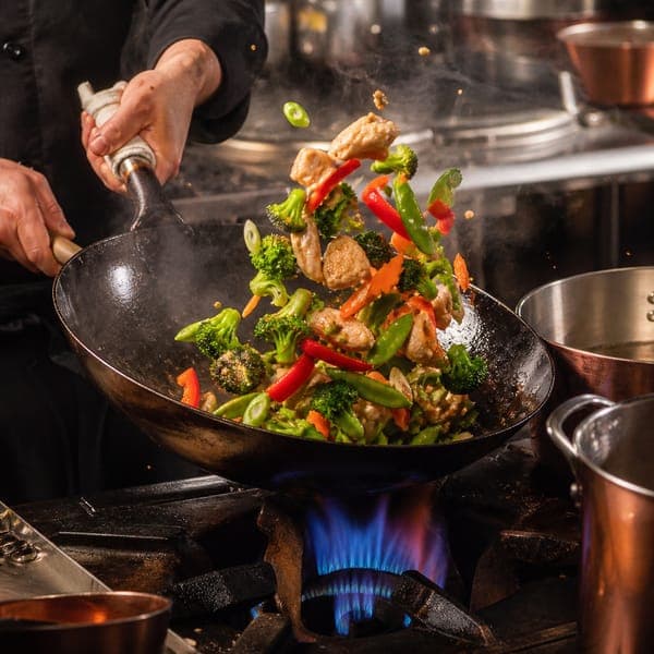 Stir-Fry on High Heat jigsaw puzzle — Vegetables leaping from the wok over a roaring blue flame.